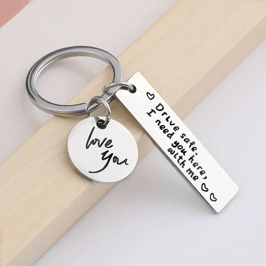 "Drive Safe, I Need You Here With Me" Metal Keychain โ Romantic Gift for Men & Women